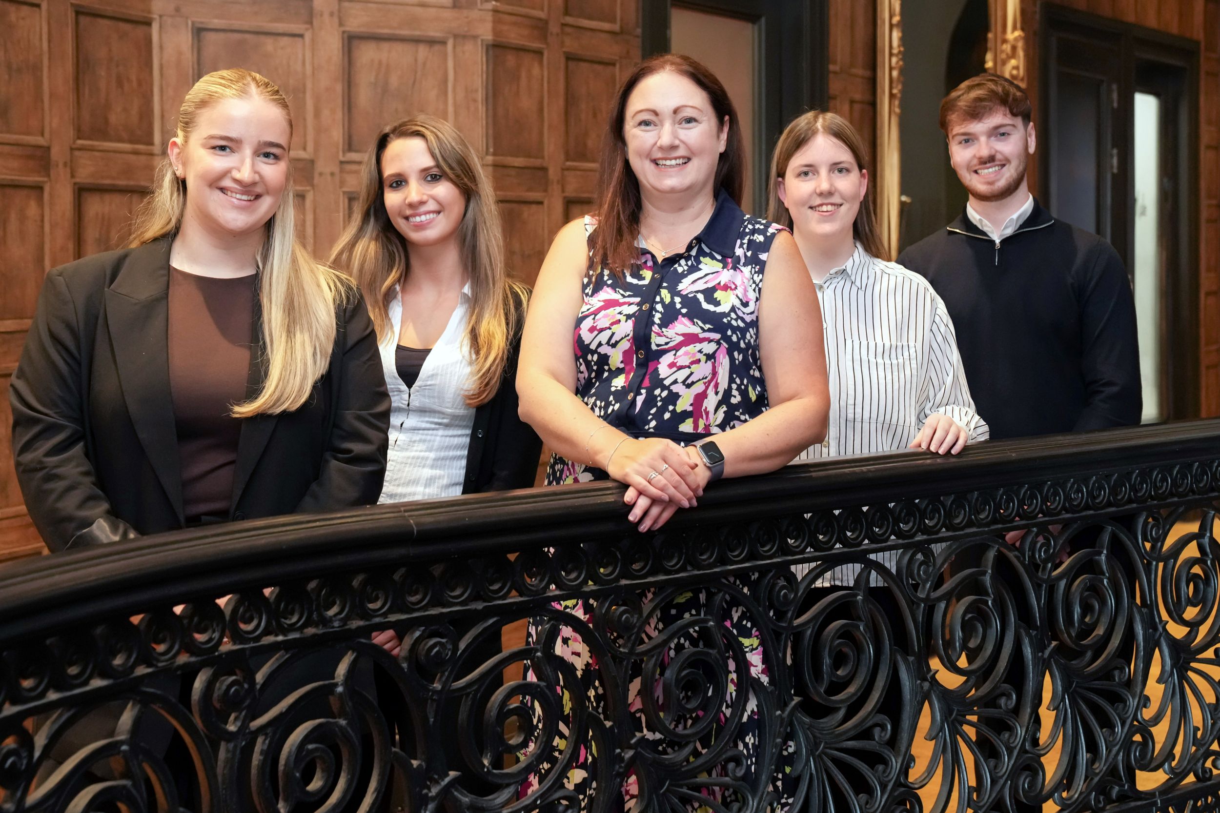 Johnston Carmichael CEO, Lynne Walker, pictured with the four graduate students.