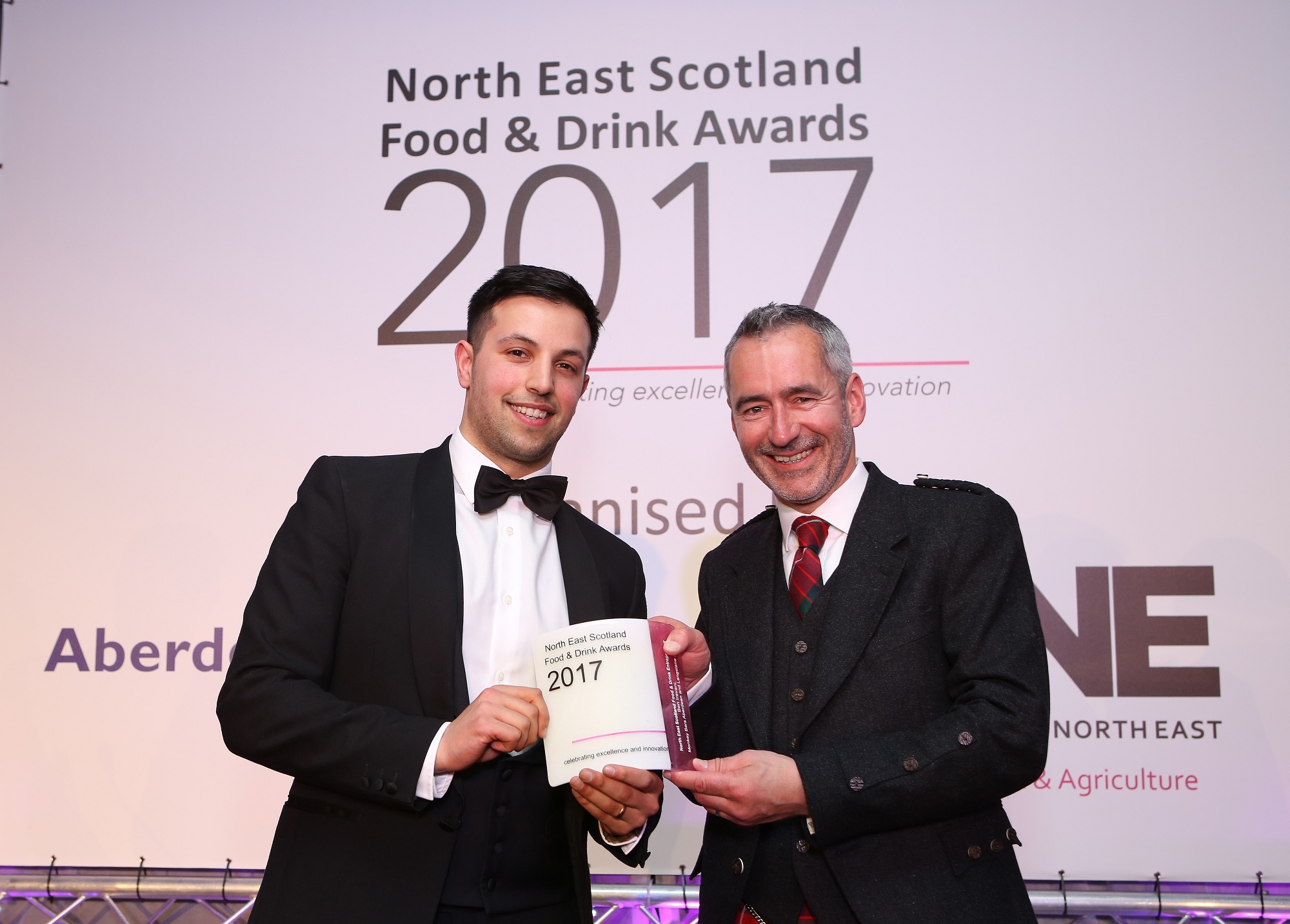 Pictured: Ben Iravani receiving the award from Graeme Fraser